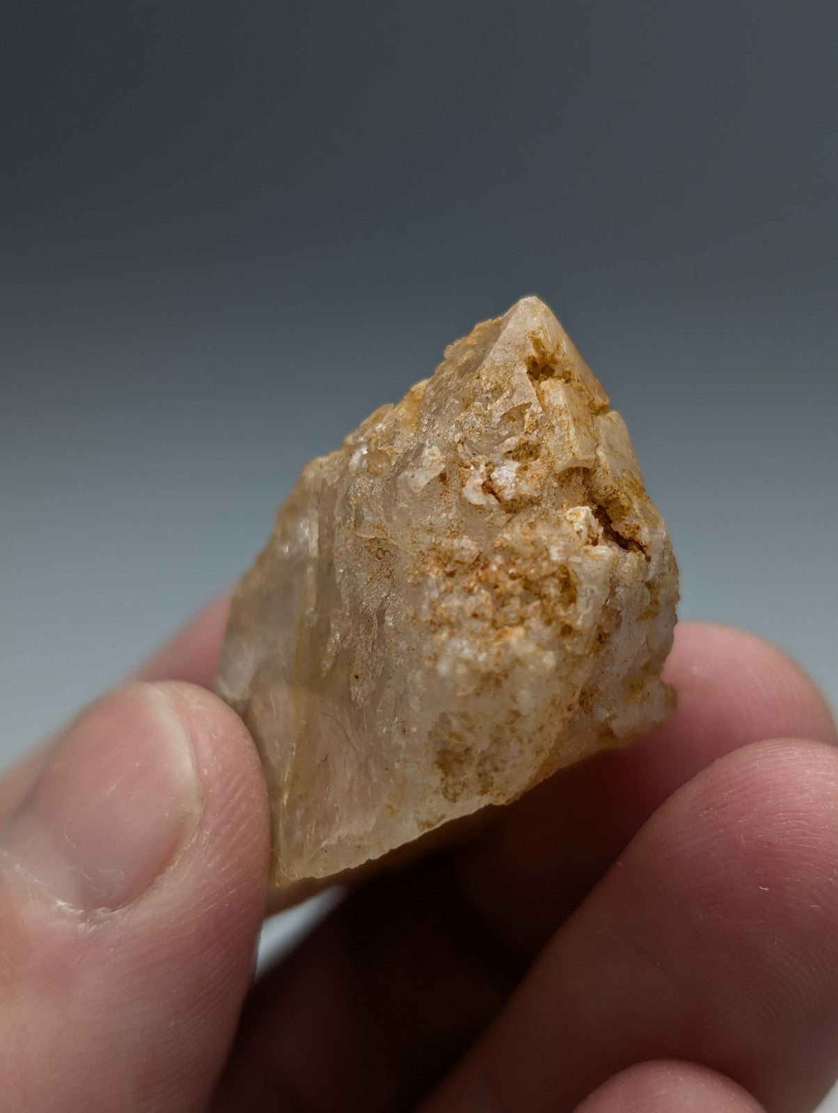 Unique dissolution quartz crystal point with pale yellow hue and golden inclusions from garland county arkansas