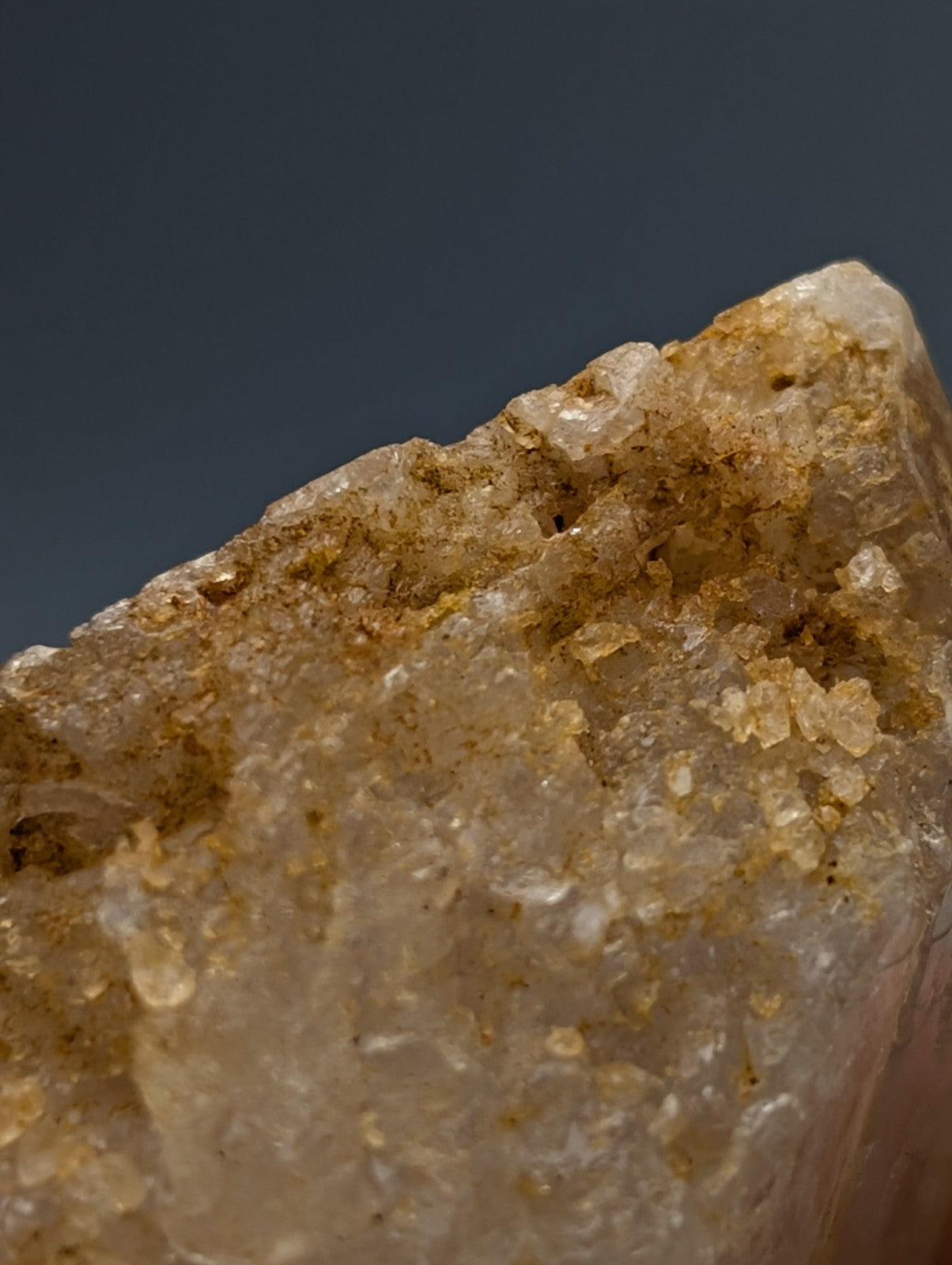Unique dissolution quartz crystal point with pale golden translucent hue and internal crystalline formations from arkansas