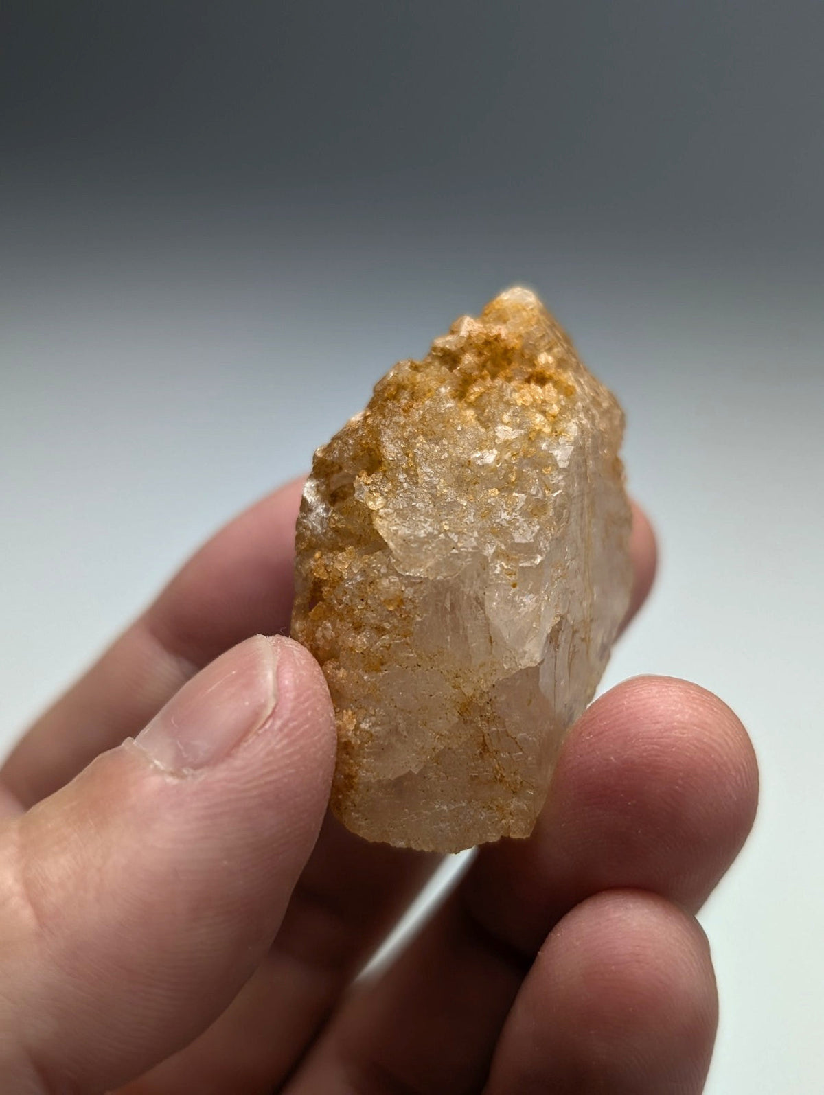 Unique dissolution quartz crystal point with translucent golden yellow rough surface and internal structure from arkansas