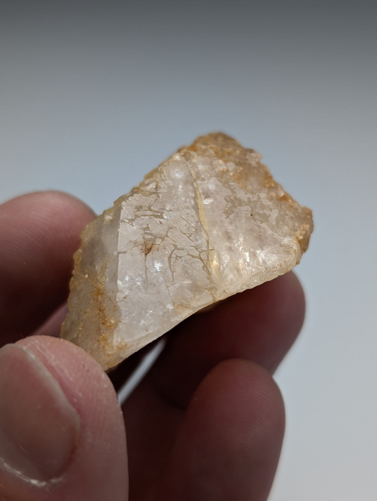 Unique dissolution quartz crystal point with translucent pale yellow color and visible internal fractures from Arkansas