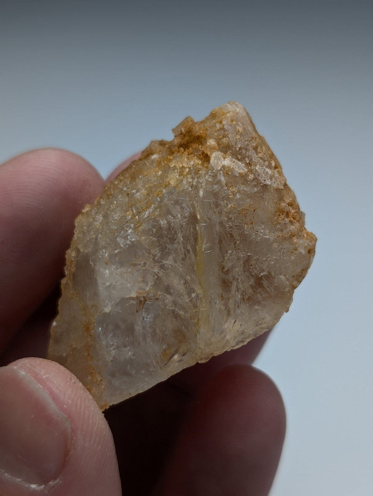 Unique dissolution quartz crystal point in pale yellow with rough jagged surface and internal striations from Arkansas