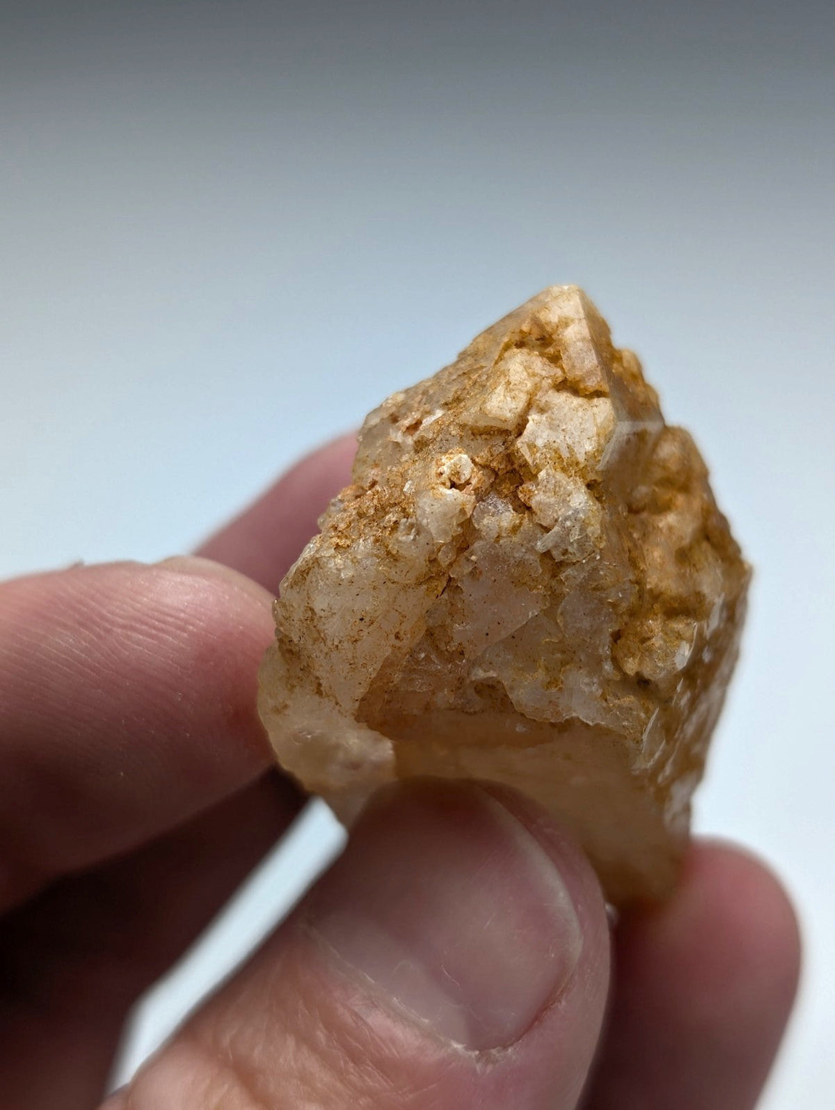 Unique dissolution quartz crystal point with translucent golden-yellow color and rough surface from Garland County Arkansas