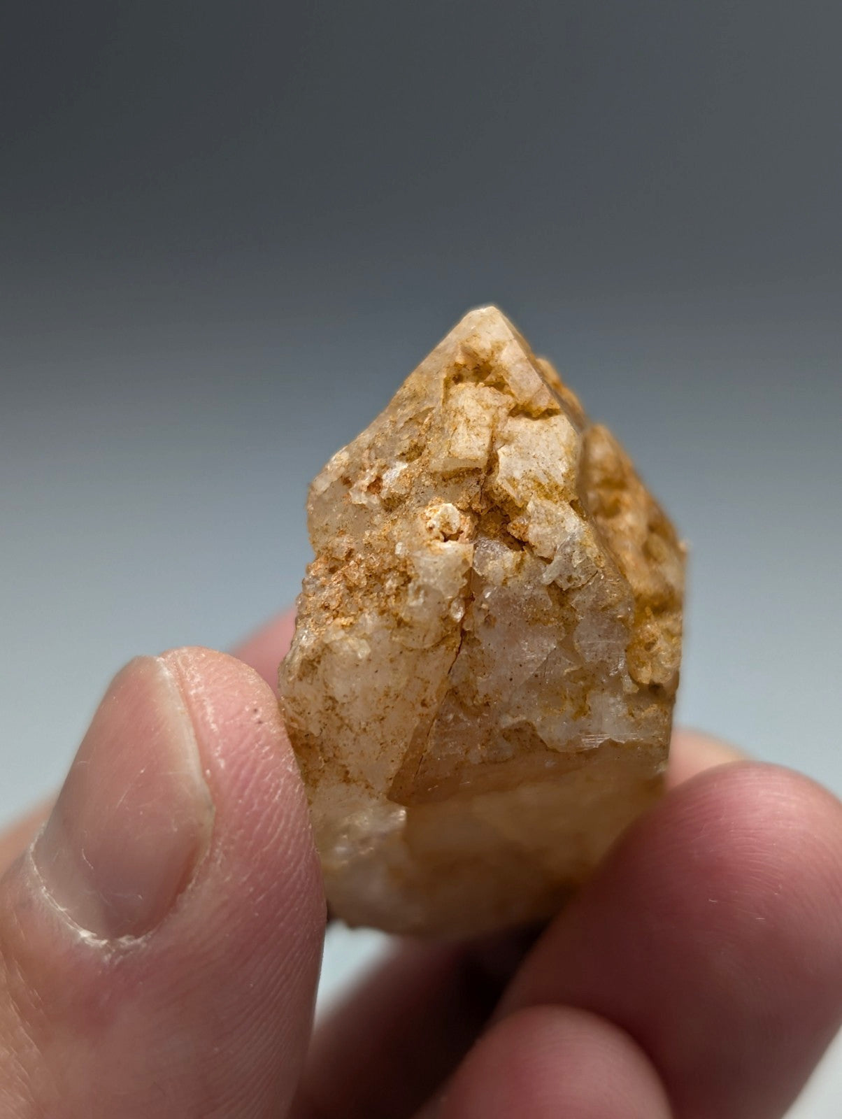 Unique dissolution quartz crystal point in pale yellow with visible internal inclusions from Garland County Arkansas