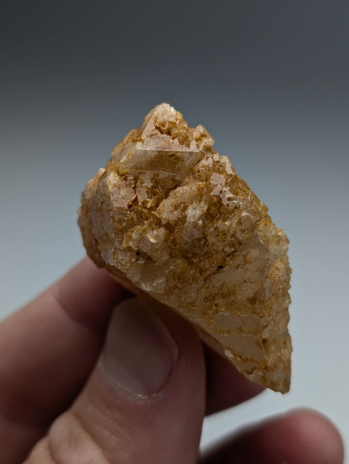 Unique dissolution quartz crystal point in golden yellow with rough crystalline texture and translucent patches from garland county arkansas