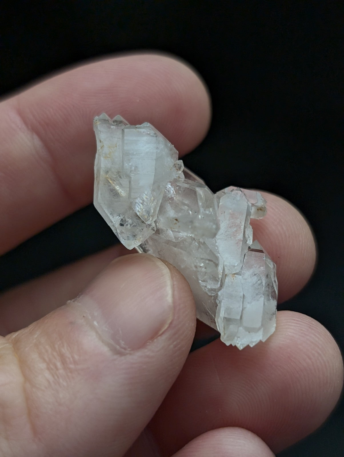 Unique double terminated floater quartz crystal cluster with sharp geometric facets and cloudy translucent appearance