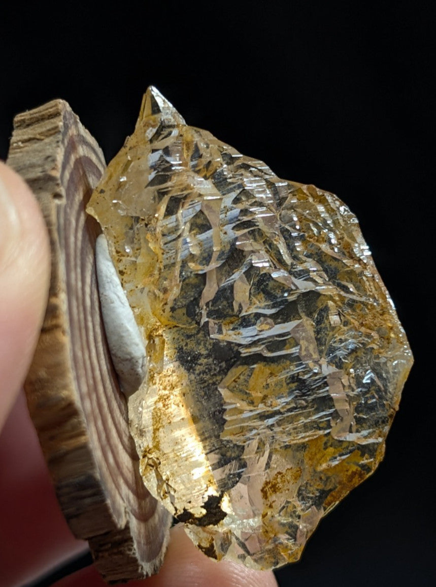 Unique etched quartz crystal point from Garland County Arkansas with translucent golden-yellow layered patterns and rough exterior