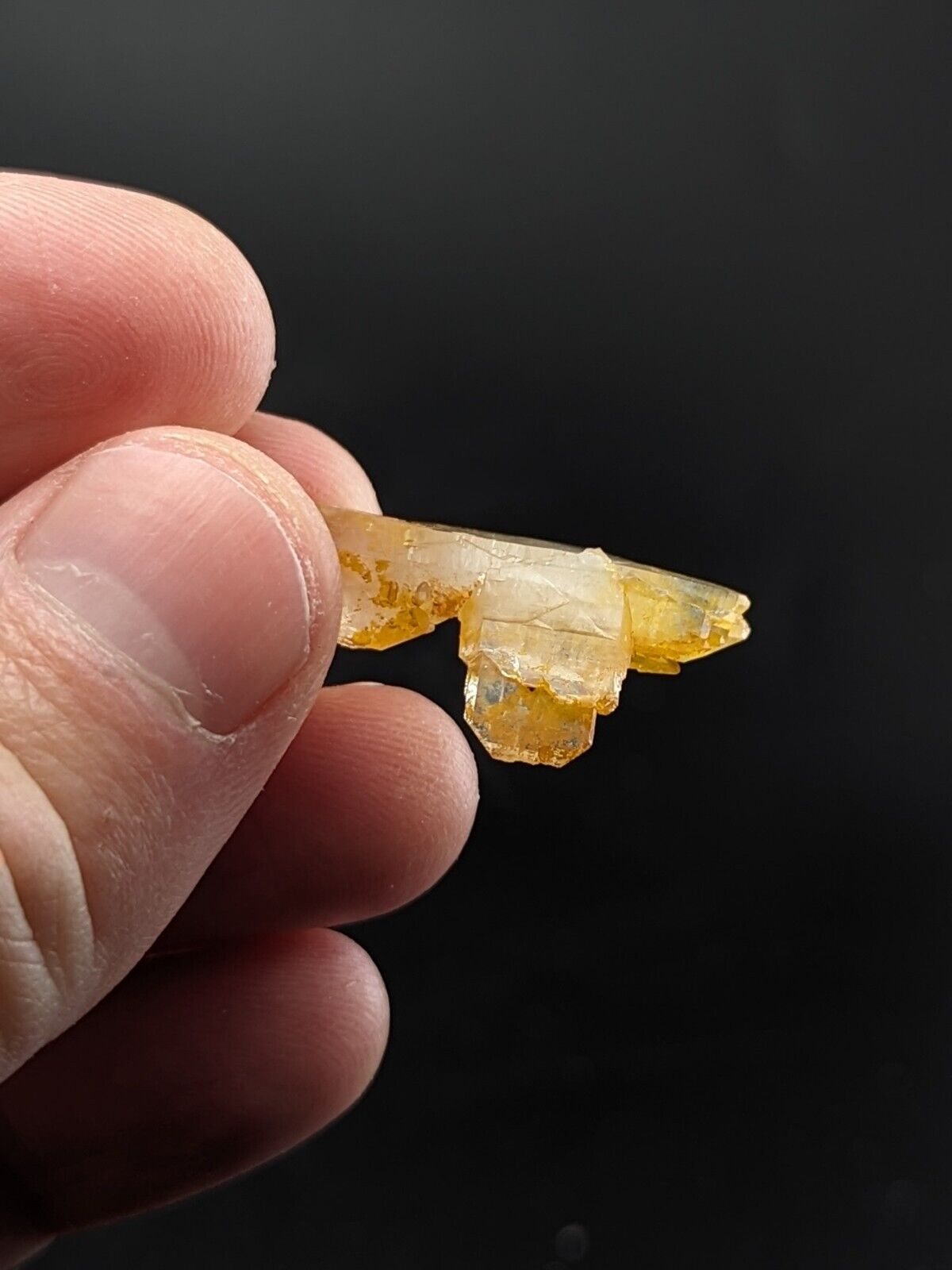 Translucent, yellow-tinged crystal formation.