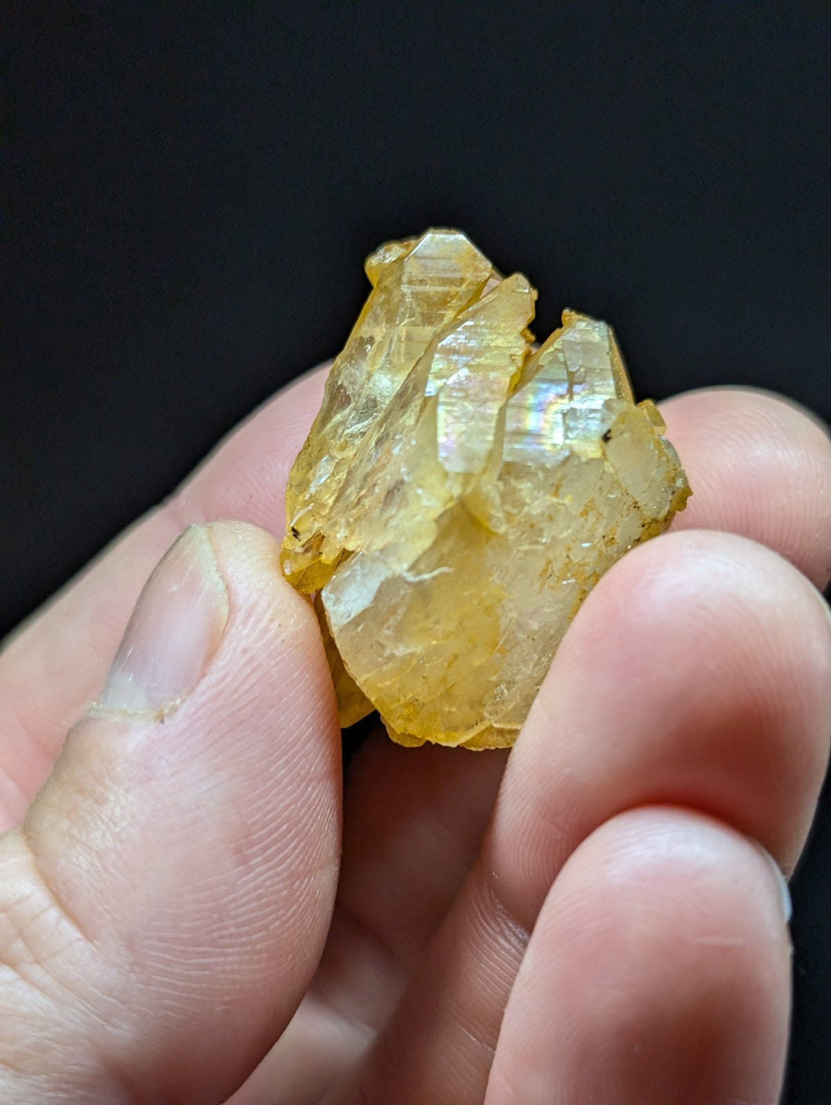 A translucent yellow crystal cluster with sharp, faceted edges and a slightly rough texture.