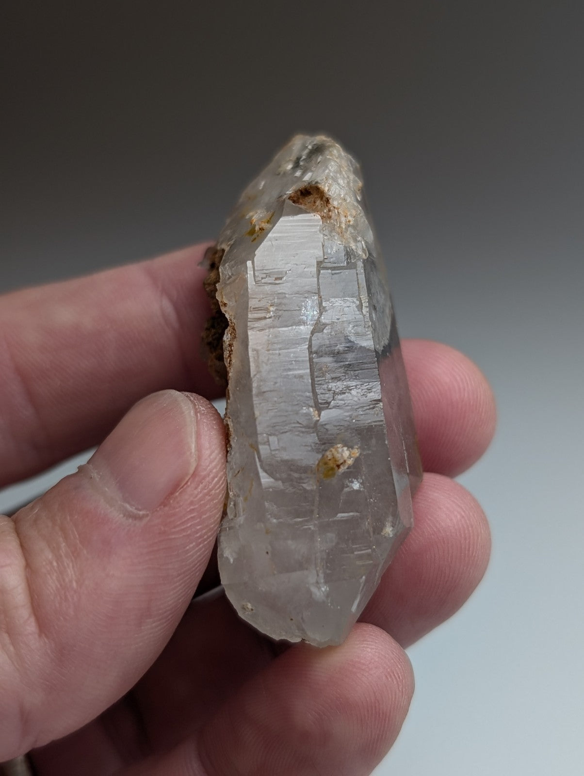 Unique quartz crystal with nacrite inclusions from montgomery county Arkansas featuring translucent clear quartz and rough base