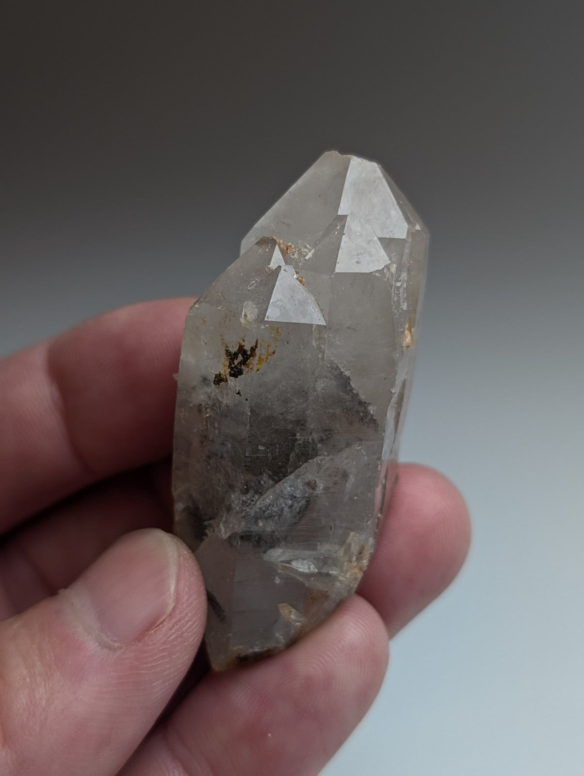 Unique quartz crystal with grayish-white nacrite inclusions and natural facets from montgomery county arkansas usa
