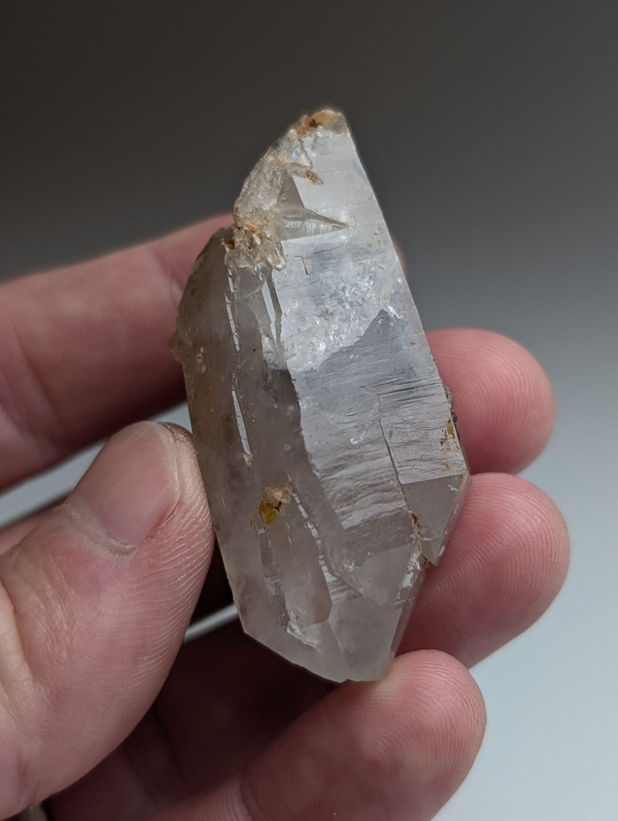 Unique quartz crystal with natural striations and brown nacrite inclusions from Montgomery County Arkansas USA