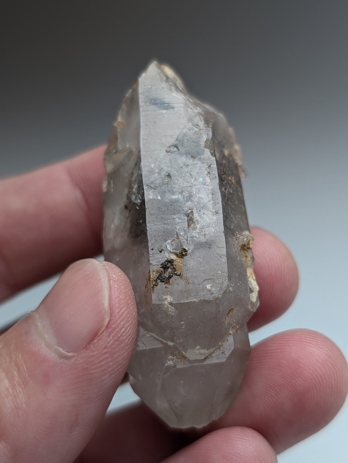 Unique pale gray quartz crystal with nacrite inclusions and natural facets from montgomery county arkansas usa