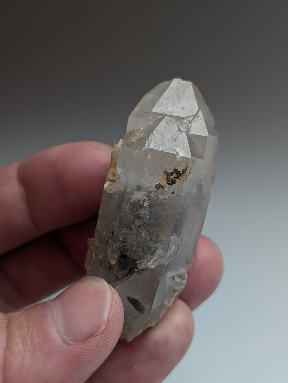 Unique clear quartz crystal with nacrite inclusions and pointed tip from Montgomery County Arkansas USA