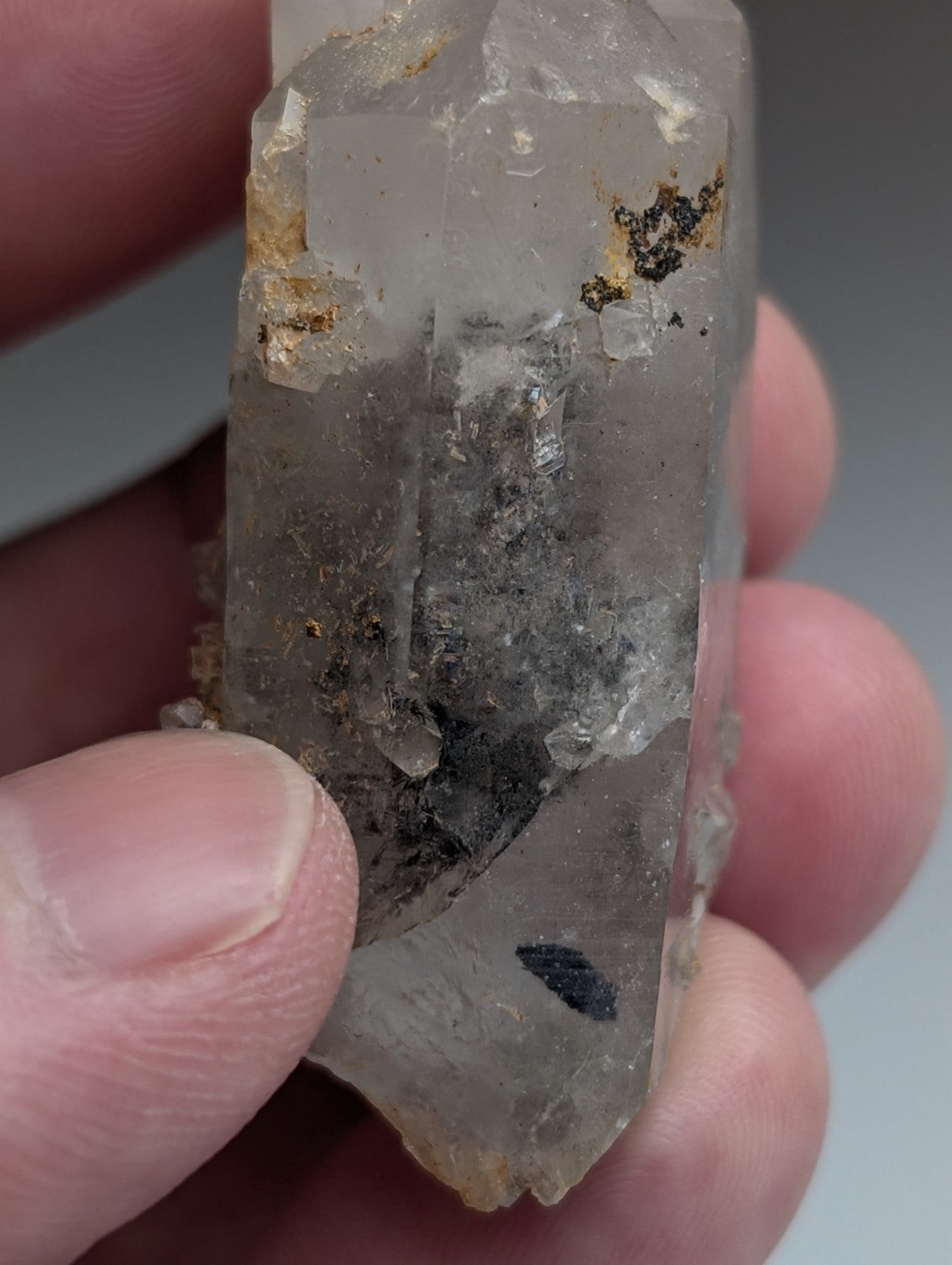 Unique quartz crystal with translucent nacrite inclusions and earthy mineral deposits from Montgomery County Arkansas