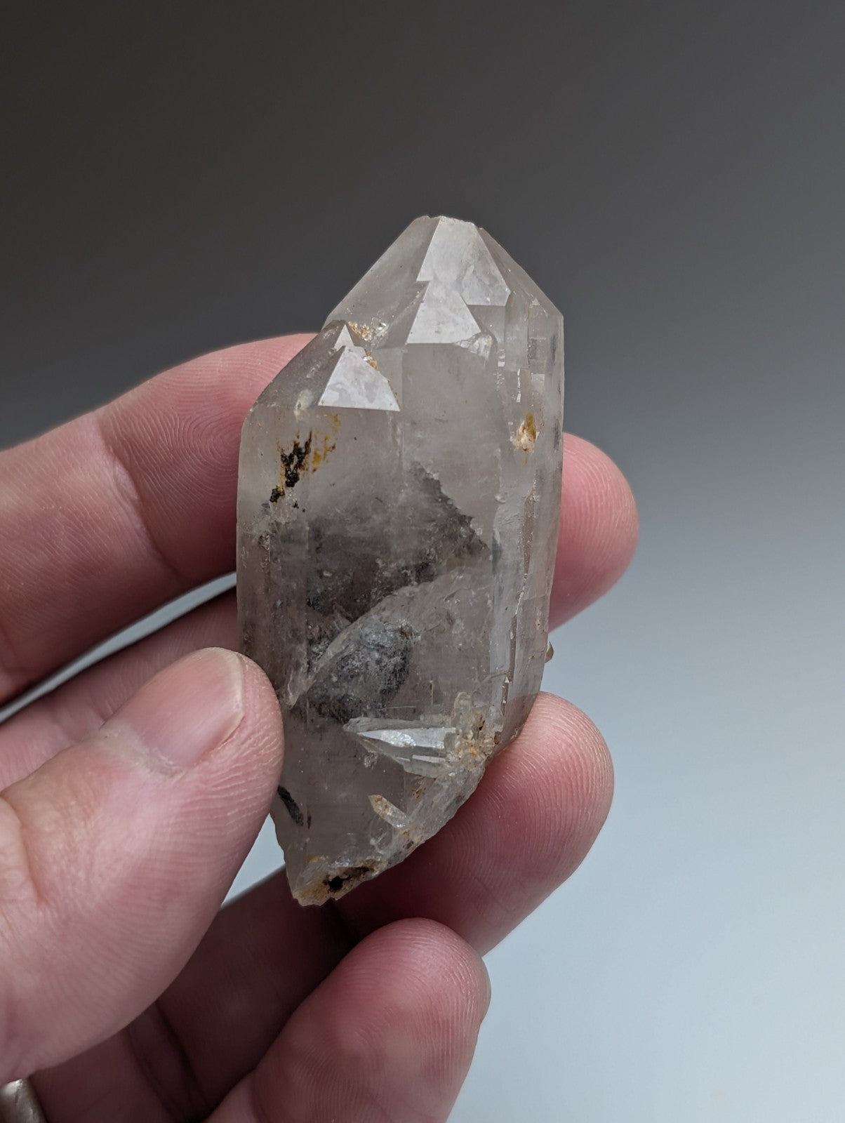 Unique quartz crystal with clear nacrite inclusions and pointed tip from montgomery county arkansas usa