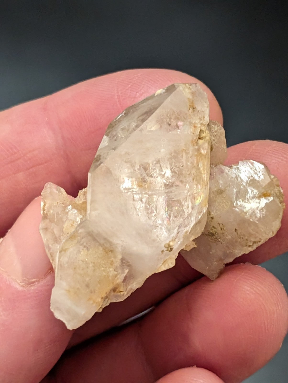 A translucent, pale yellowish quartz crystal cluster with rough edges and natural inclusions.