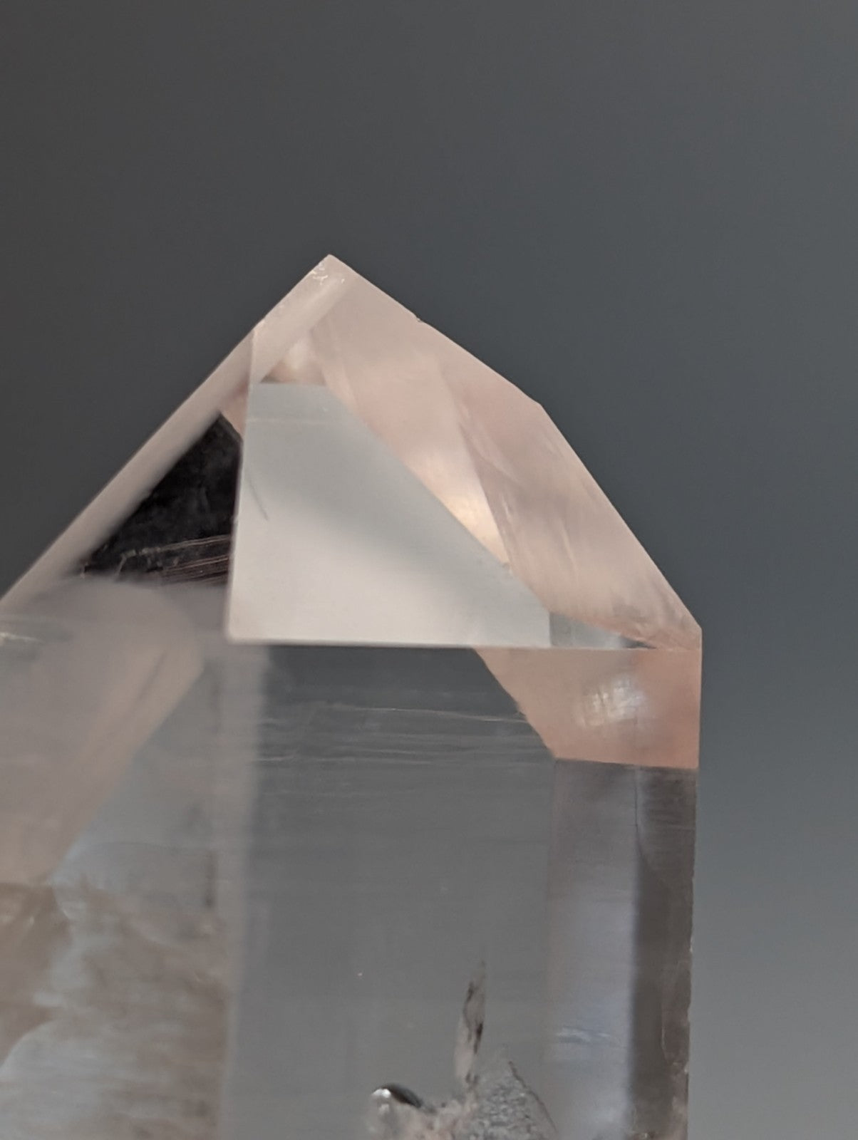 Unique quartz crystal point with pale pink translucent color and geometric facets from Arkansas usa old stock A plus grade