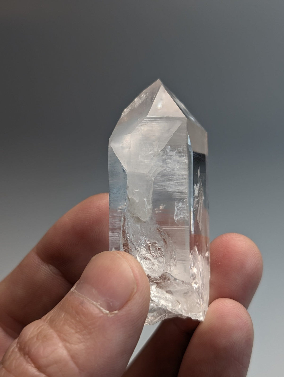 Unique quartz crystal point from Arkansas with a clear pointed top and natural internal inclusions A plus grade