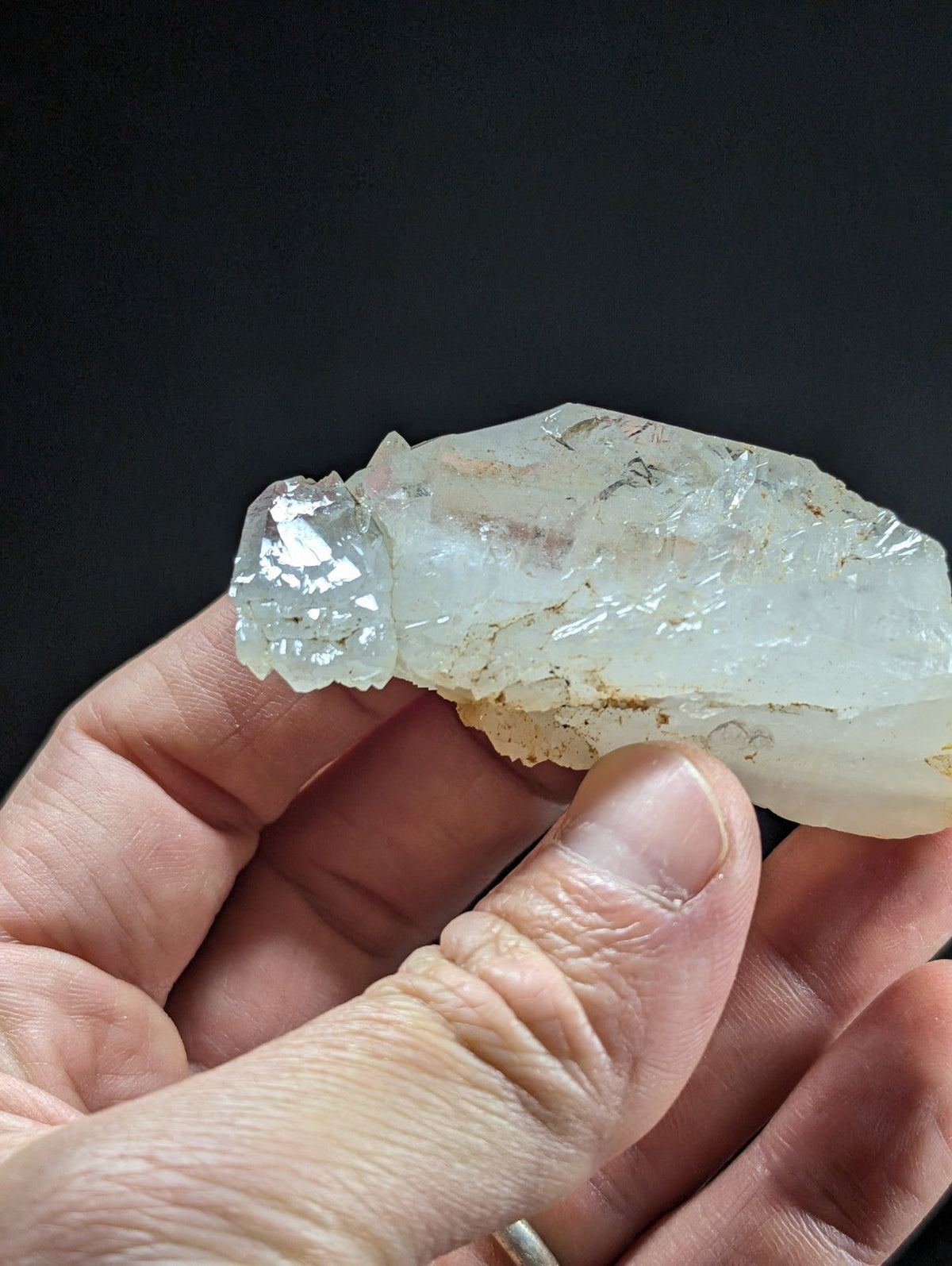 A translucent, pale quartz crystal with natural facets and subtle internal inclusions.