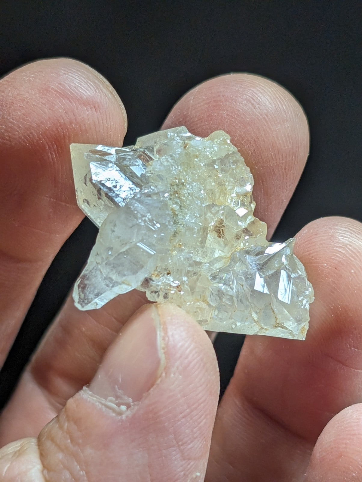 A translucent, pale yellow crystal cluster with sharp, faceted edges and a slightly rough texture.