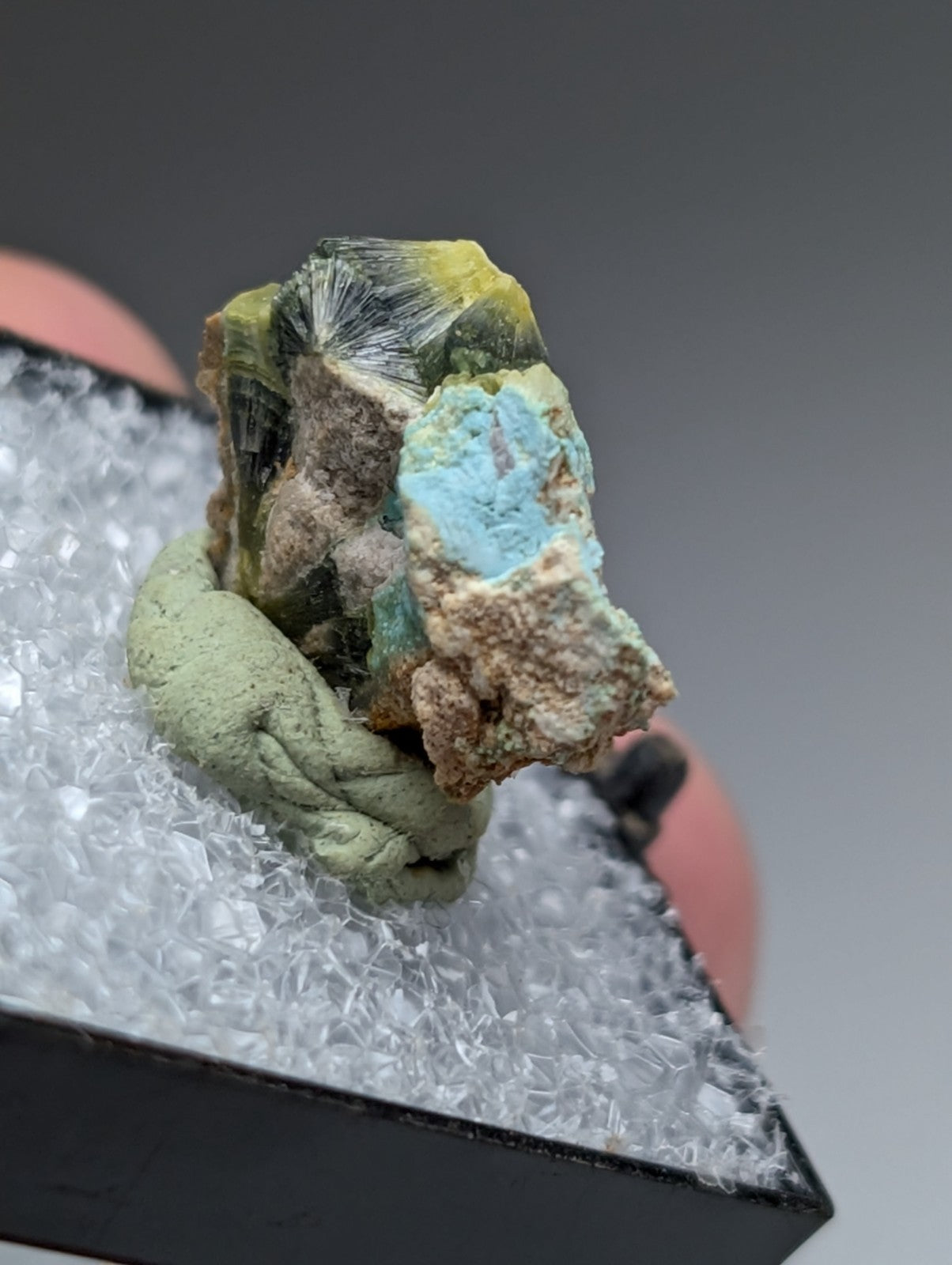 Unique wavellite mineral with vibrant turquoise patch and greenish yellow crystals in brown matrix from arkansas