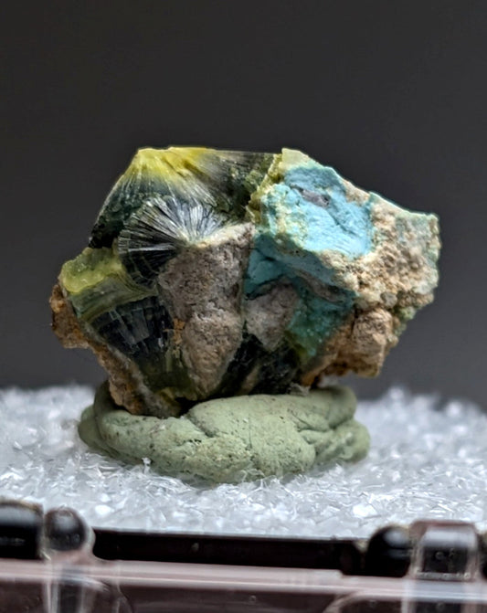 Unique wavellite mineral specimen with vibrant turquoise and yellow fan-like crystals on earthy matrix from Arkansas