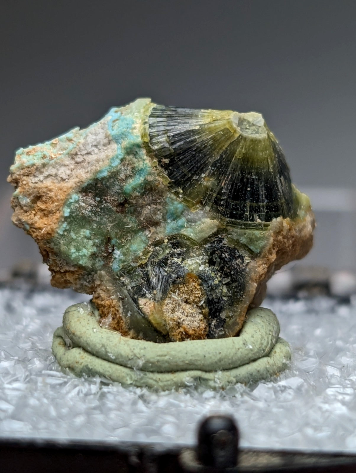 Unique green and black wavellite mineral with fan-shaped crystals in orange gray rock from Garland County Arkansas