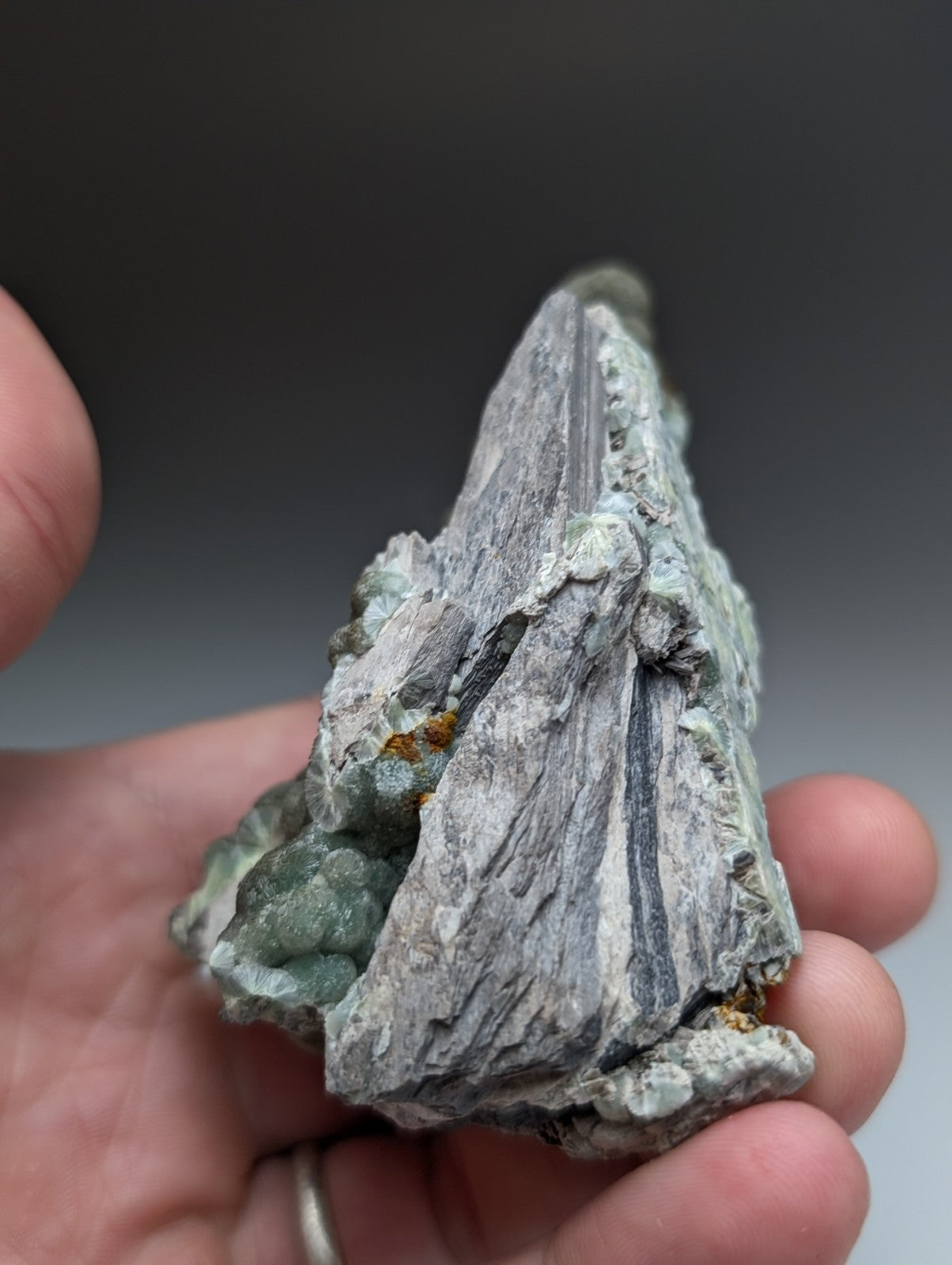Uv reactive green wavellite cluster with gray textured mineral and greenish crystal patches from mauldin mountain arkansas