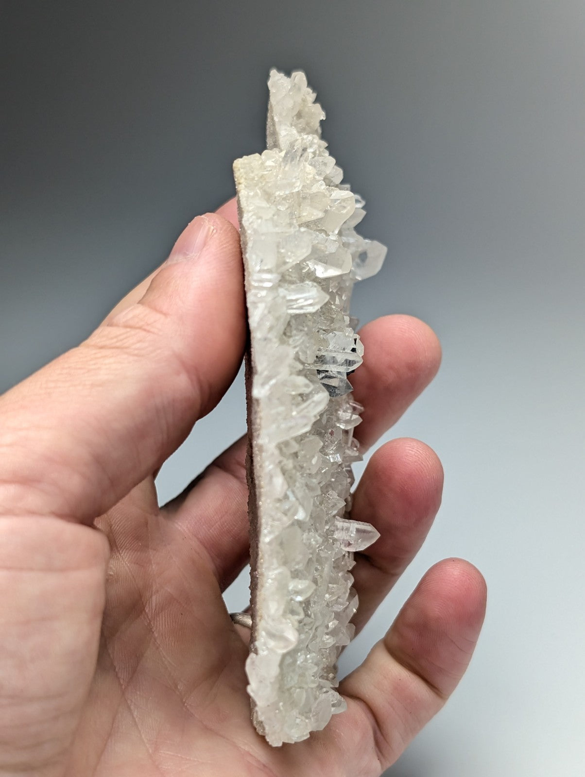 Very rare brookite on translucent clear quartz crystal cluster with jagged surface and pointed tips from arkansas usa