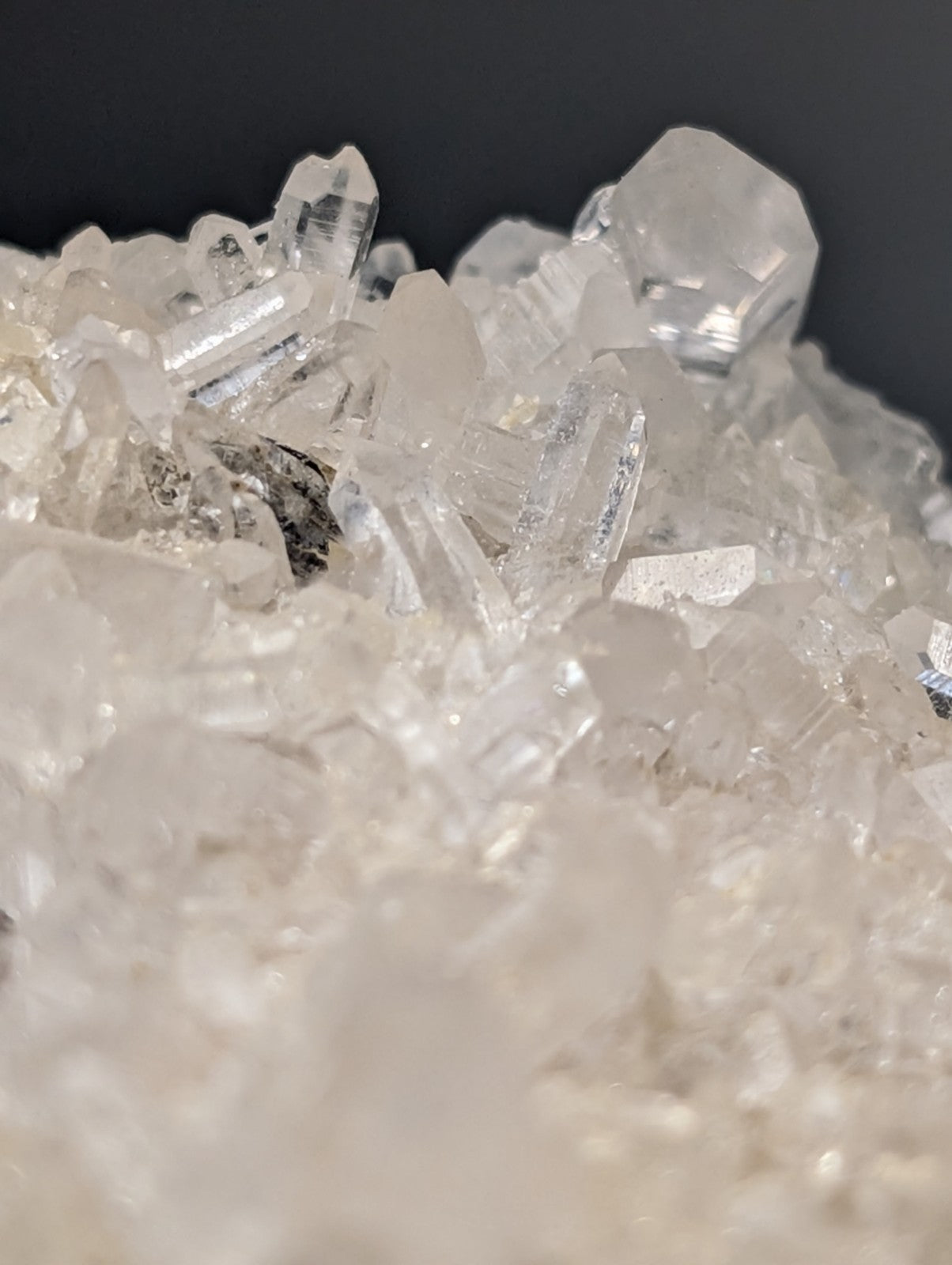 A cluster of clear translucent quartz crystals with sharp faceted edges on very rare brookite from Miller Mountain Arkansas