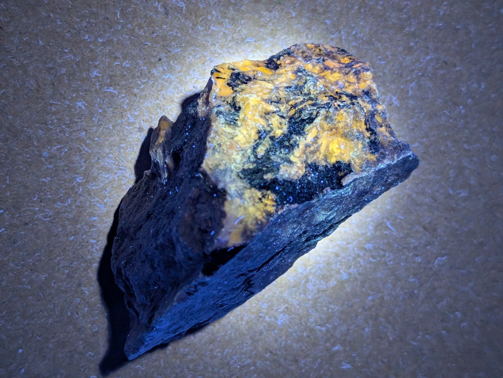 Very rare miserite and wollastonite mineral specimen with dark base and vibrant yellow orange patches from arkansas