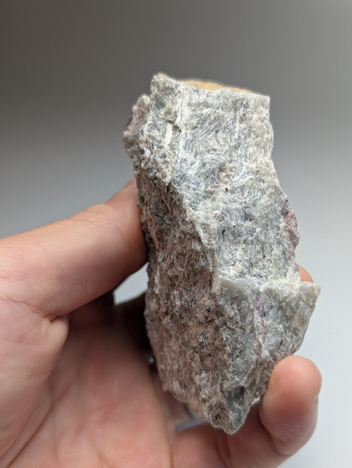 Very rare miserite and wollastonite gray rock with purple and white mineral veins from wilson springs arkansas usa