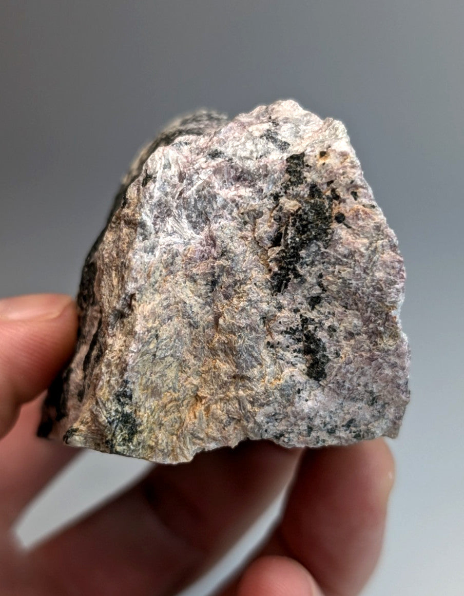 A rough irregularly shaped granite rock with gray white and black speckles from wilson springs arkansas usa
