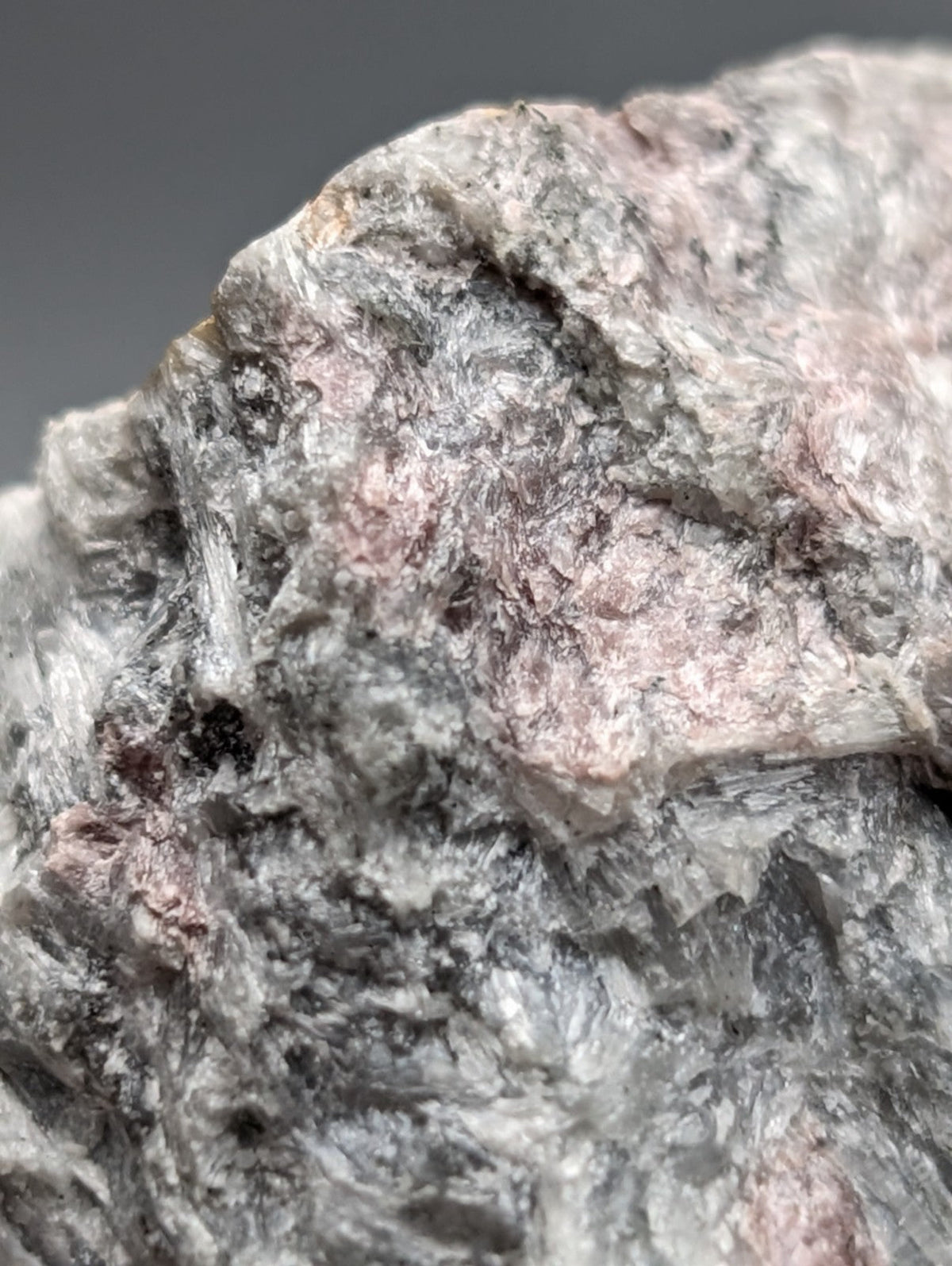 Very rare miserite and wollastonite mineral specimen with rough textured gray and pinkish surface from Arkansas usa