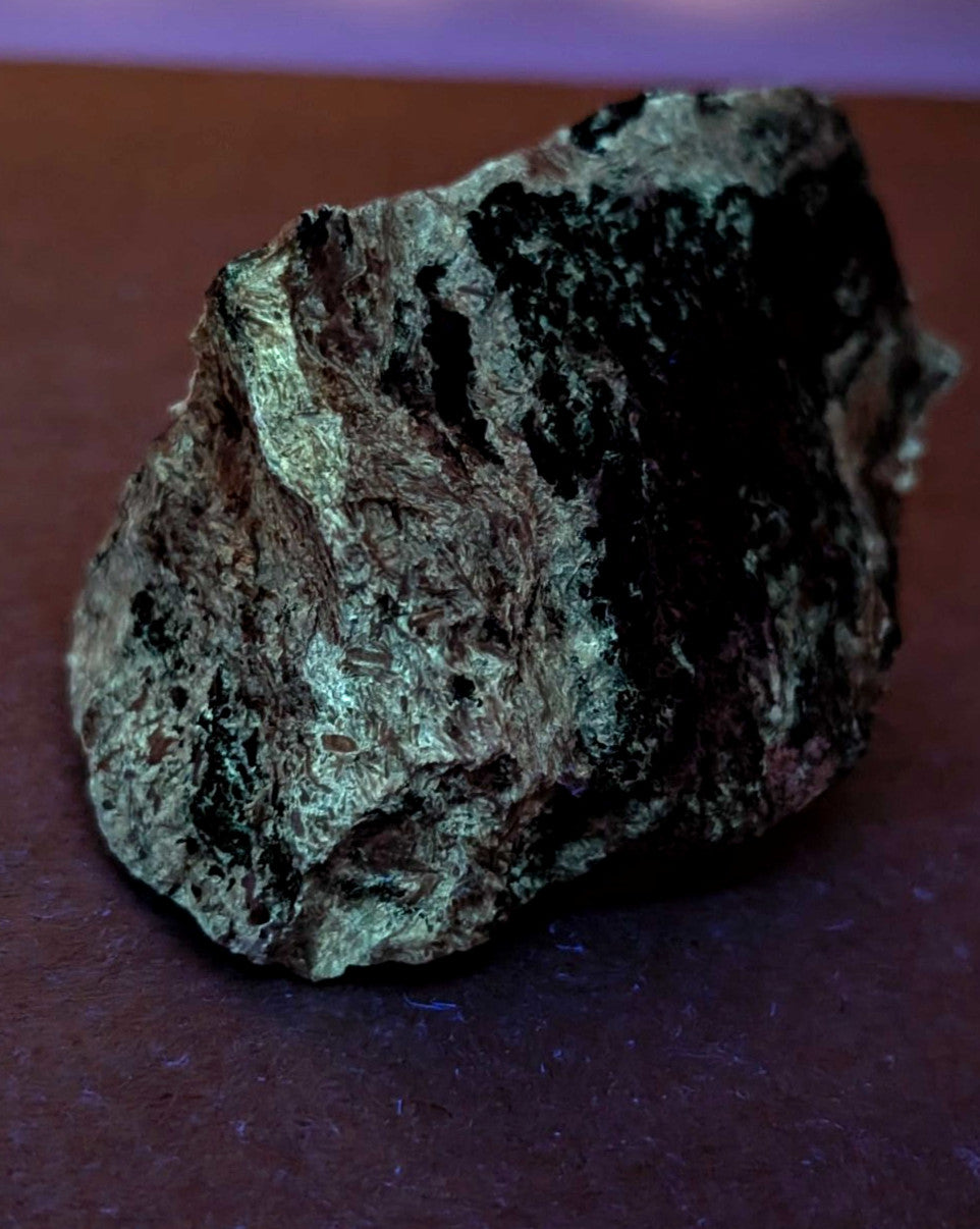 Very rare miserite and wollastonite mineral specimen with dark green and black patches on metallic gray base from arkansas usa