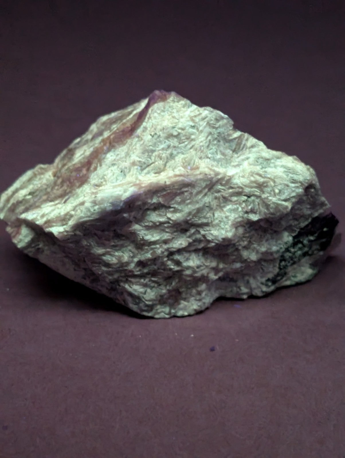 Very rare miserite and wollastonite mineral specimen from wilson springs arkansas with pale greenish-white surface and reddish streaks