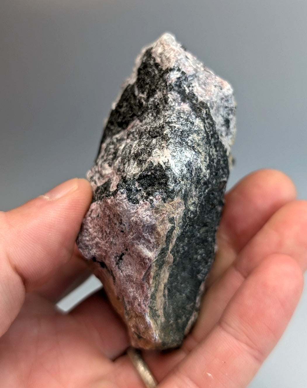 Very rare miserite and wollastonite rock with mottled dark gray black and pink hues from wilson springs arkansas usa
