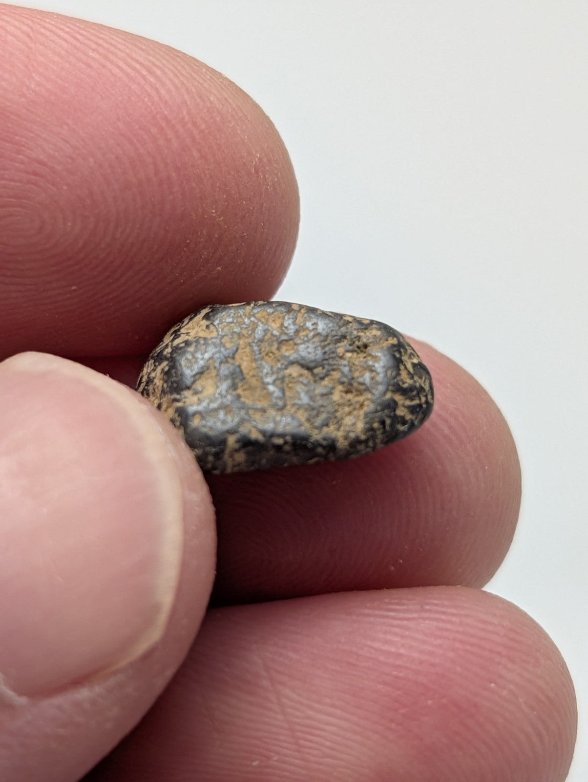 Very rare placer rutile stone from magnet cove arkansas with dark rough texture and brownish yellow patches set of 25