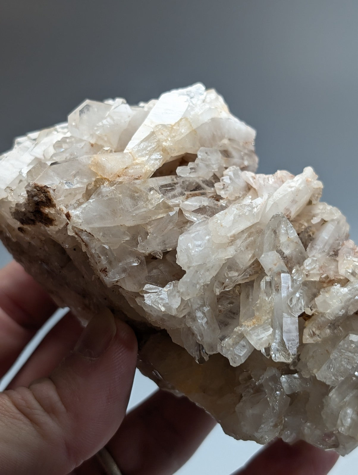 A cluster of translucent crystalline faden quartz formations with clear and milky white hues from montgomery county arkansas
