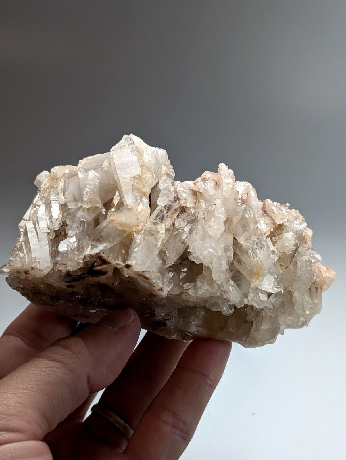 A very unique translucent faden quartz crystal cluster with a rough earthy base and sharp faceted growths from arkansas usa