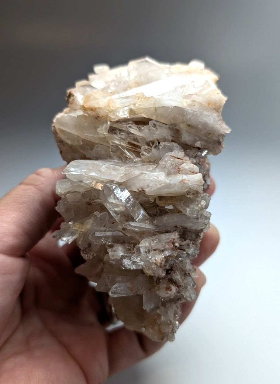 A very unique faden quartz crystal cluster with translucent clear and milky white hues from Montgomery County Arkansas