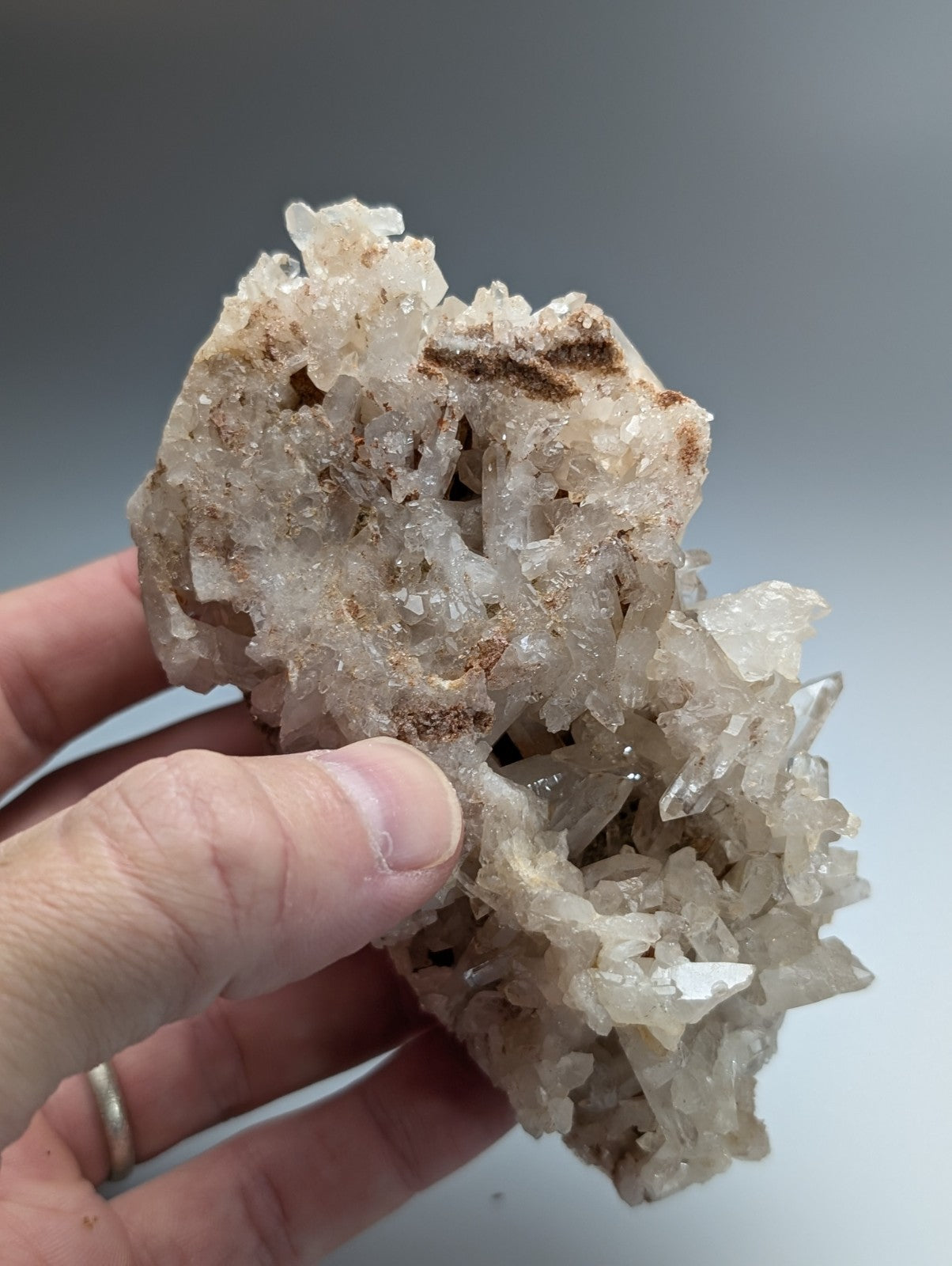A translucent faden quartz crystal cluster with rough jagged surfaces and subtle brownish streaks from montgomery county arkansas usa