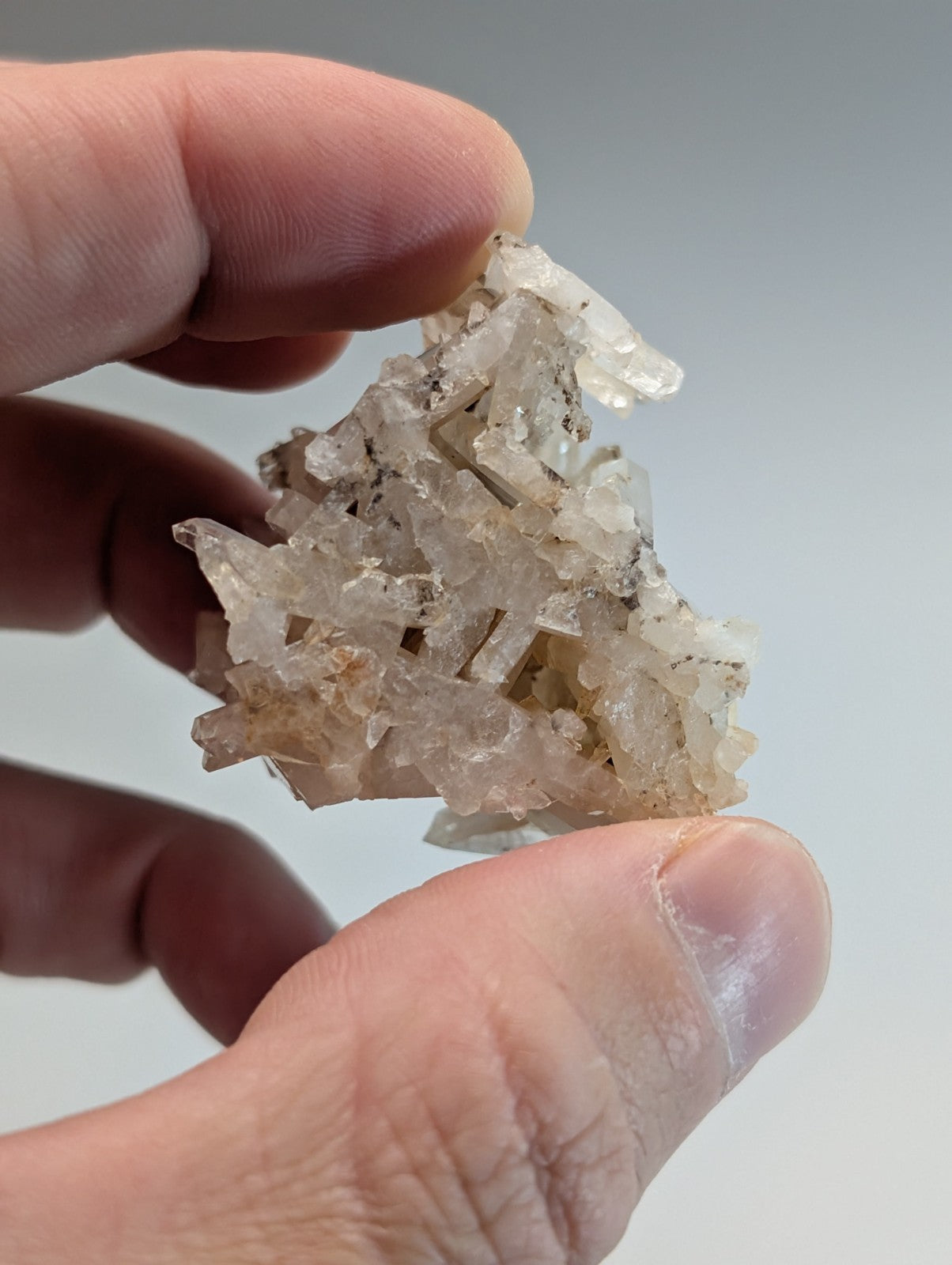 A translucent crystalline faden wheel quartz crystal with clear and cloudy facets from Montgomery County Arkansas usa