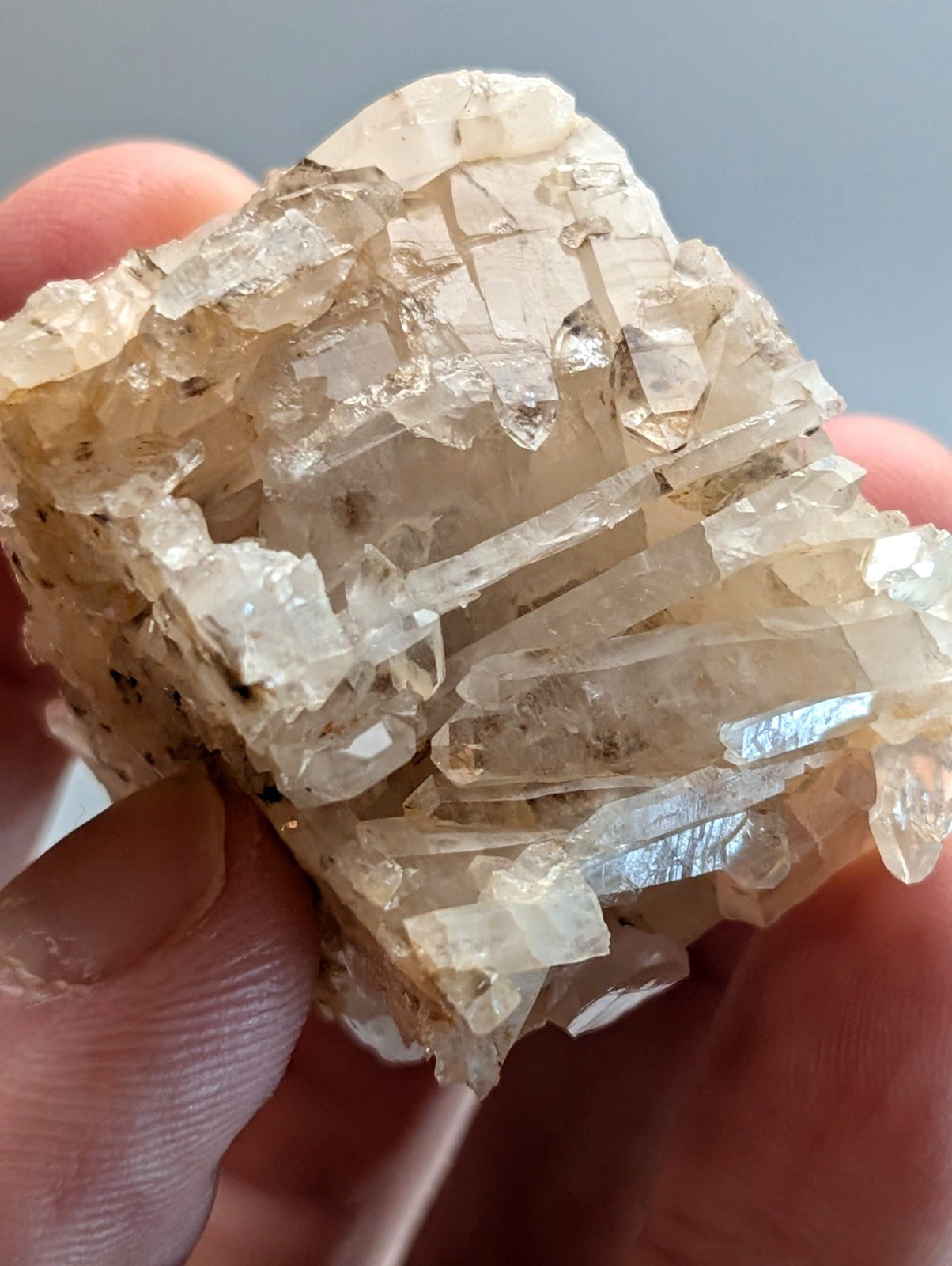A translucent pale yellowish quartz crystal cluster with sharp interlocking facets from montgomery county arkansas usa