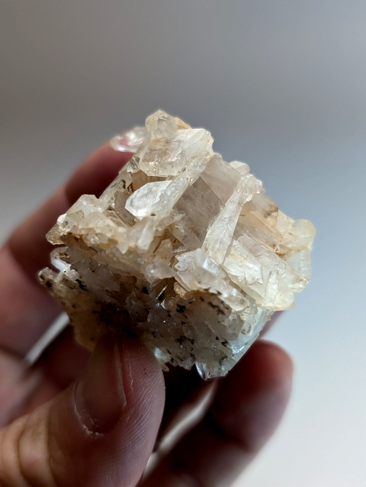 A translucent pale yellowish-white faden wheel quartz crystal cluster with rough surface and internal inclusions from arkansas usa