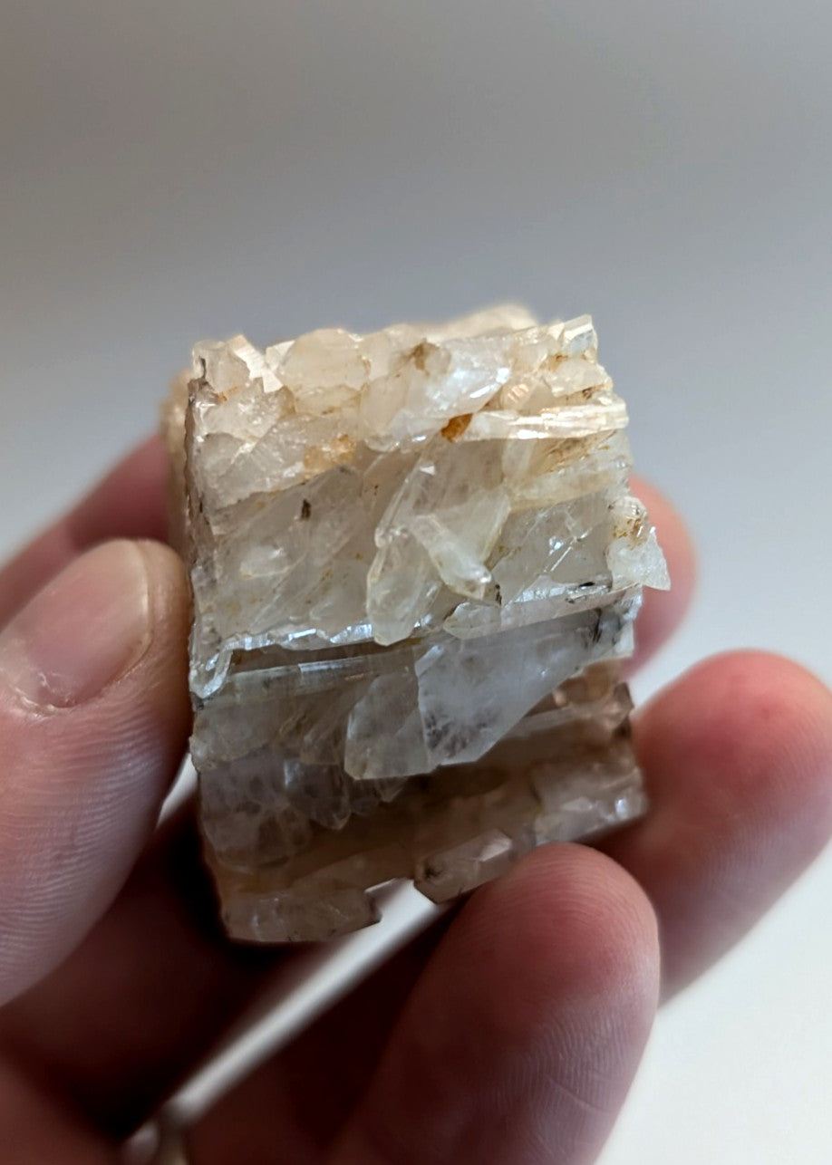 A translucent faden wheel quartz crystal with jagged surface and subtle brownish inclusions from Arkansas usa