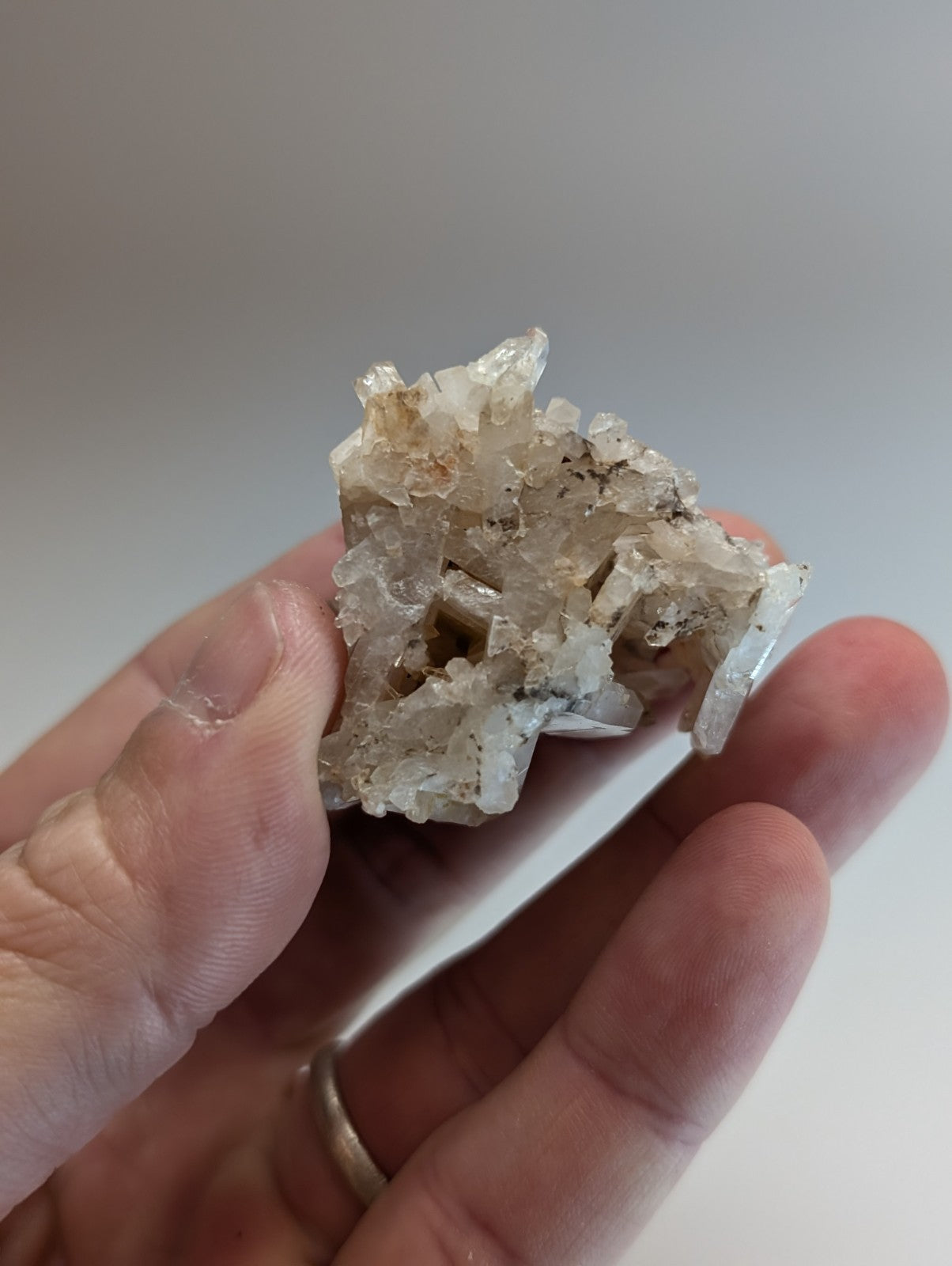 A very unique faden wheel quartz crystal from Montgomery County Arkansas with translucent white hues and dark inclusions