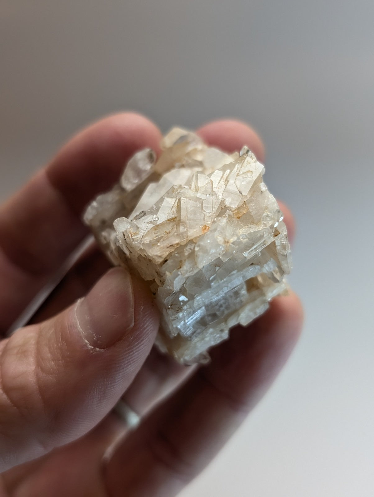 A translucent pale golden faden wheel quartz crystal with sharp facets from Montgomery County Arkansas USA