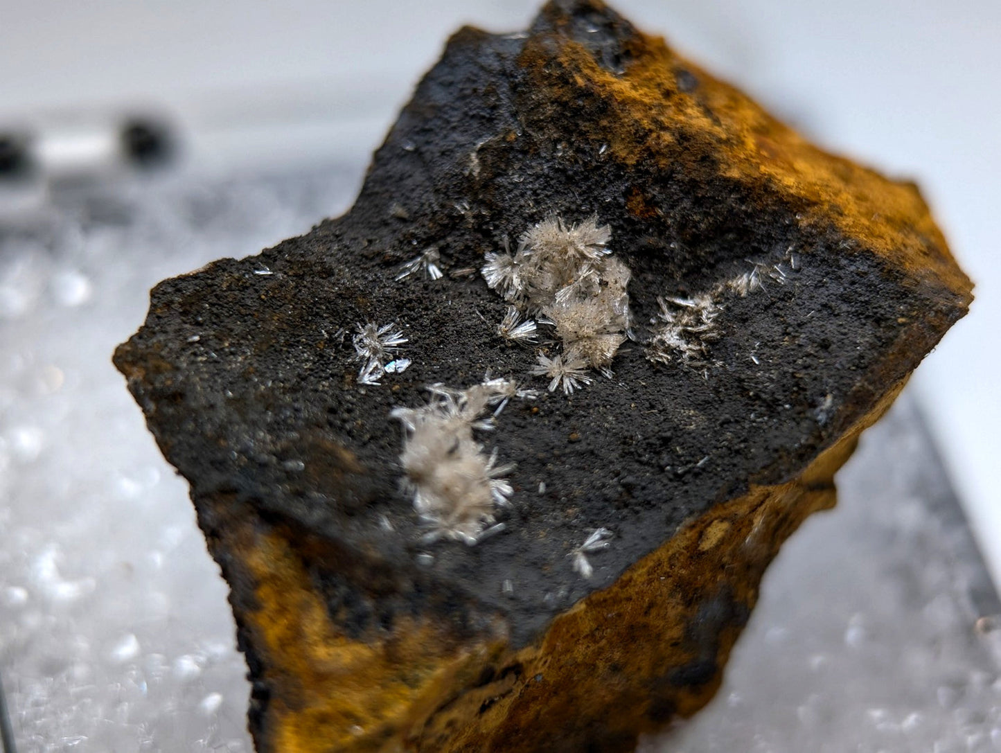 A rugged wavellite mineral from potash sulphur springs arkansas with dark surface orange rust and white crystals