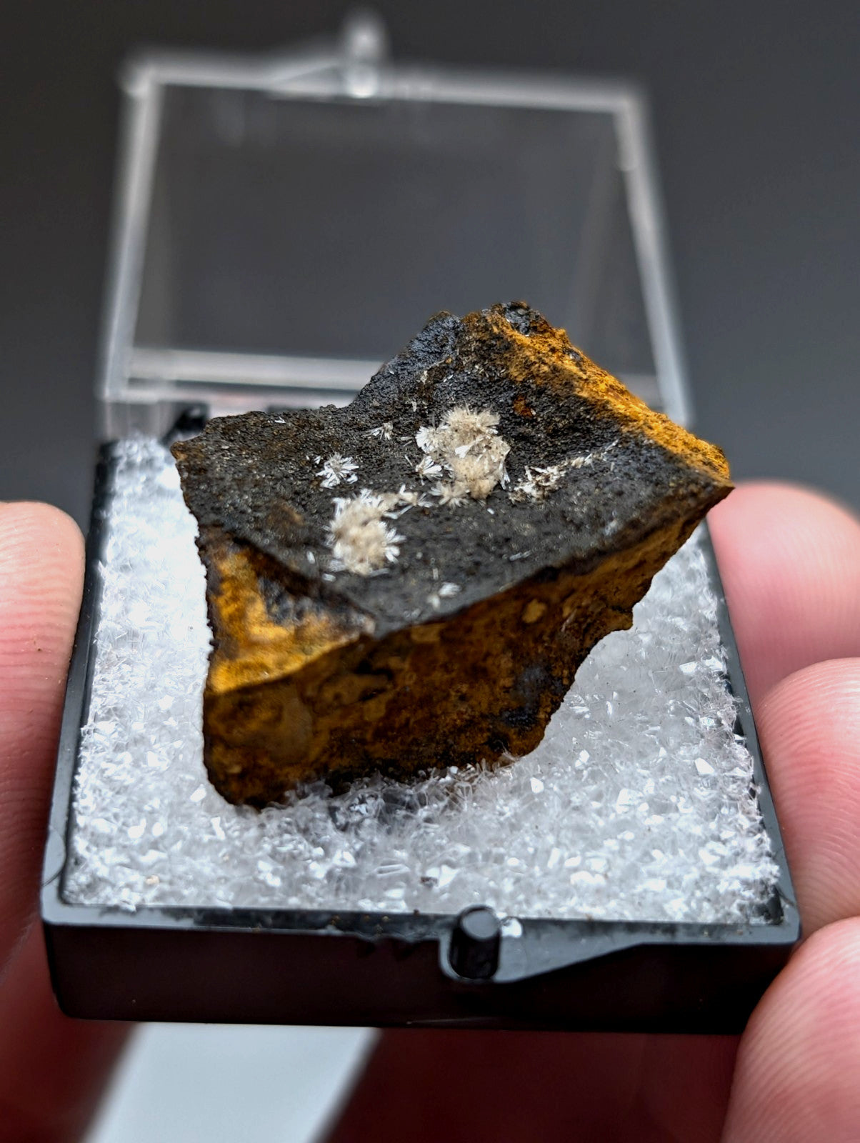 A rugged wavellite meteorite fragment from potash sulphur springs arkansas with dark core and orange yellow crust